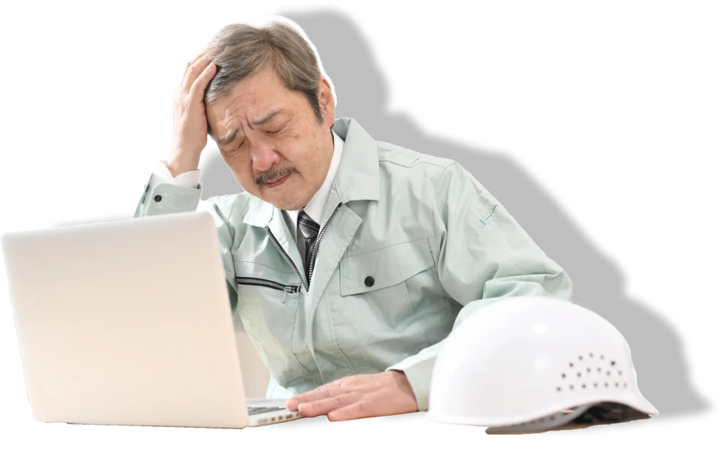 悩んでいる作業服の男性